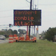 Image for article titled Jalopnik-Hacked Road Sign: We're All Going To Jail Now
